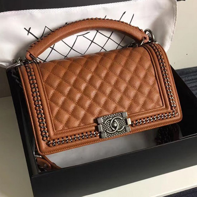 Ch**el caviar grained calfskin boy bag with top handle orange