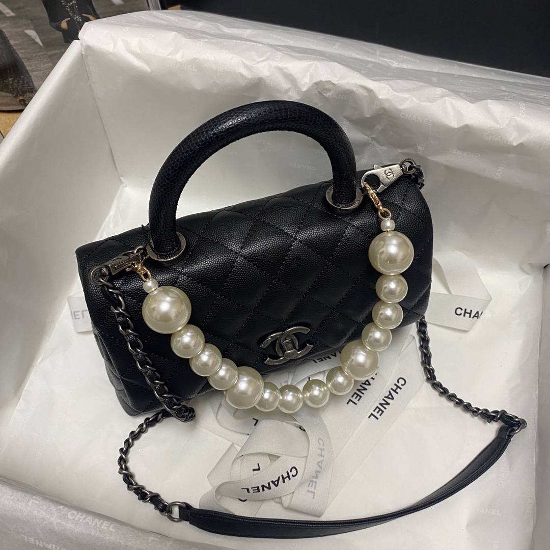 Ch**el flap bag with black top handle grained calfskin silver metal black a92990 23 cm